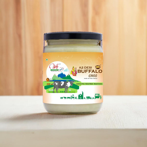 A jar of Arth Agro Farms A2 Desi Buffalo Ghee with a label showing the brand name, type of ghee, and a graphic of buffaloes. The jar is placed against a wooden background.