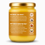 Jar of ghee with gold lid on a white background