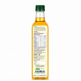 Bottle of oil with nutritional information label on a white background