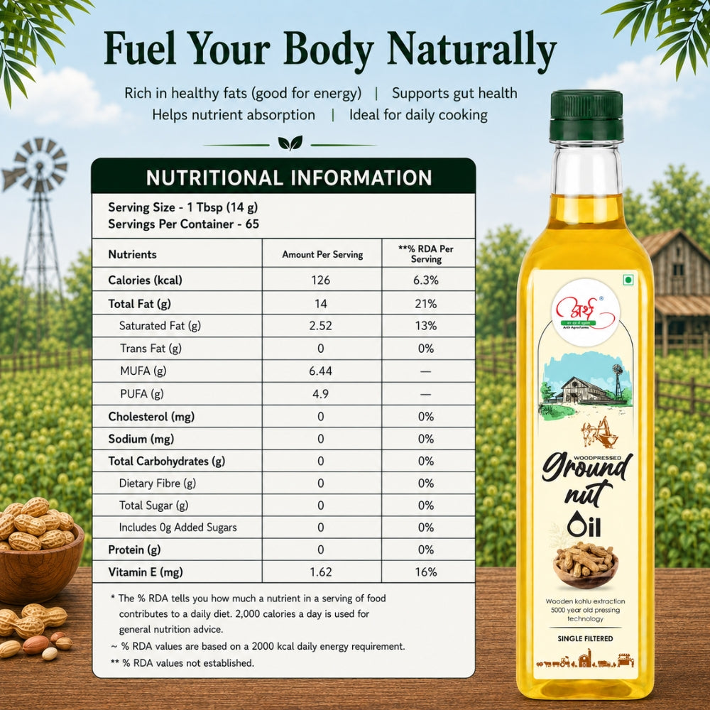 Bottle of groundnut oil with nutritional information panel on a wooden surface outdoors.