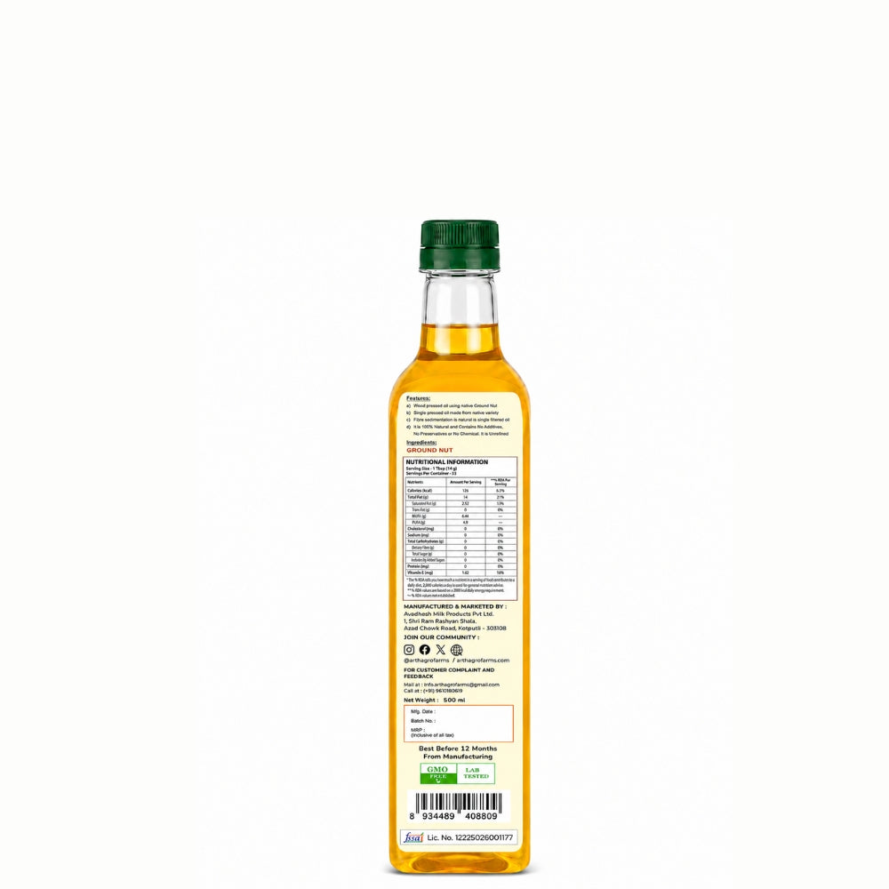 Bottle of oil with a green cap on a white background
