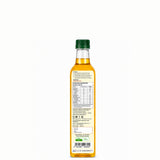 Bottle of oil with a green cap on a white background