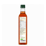 Bottle of syrup with a label on a white background