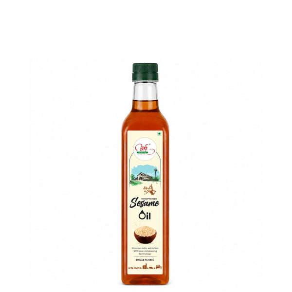 Bottle of sesame oil with a green cap on a white background