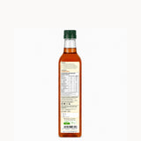 Bottle of syrup with a label on a white background