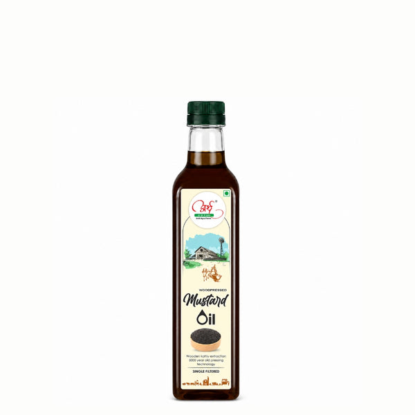 Bottle of mustard oil with a green cap on a white background