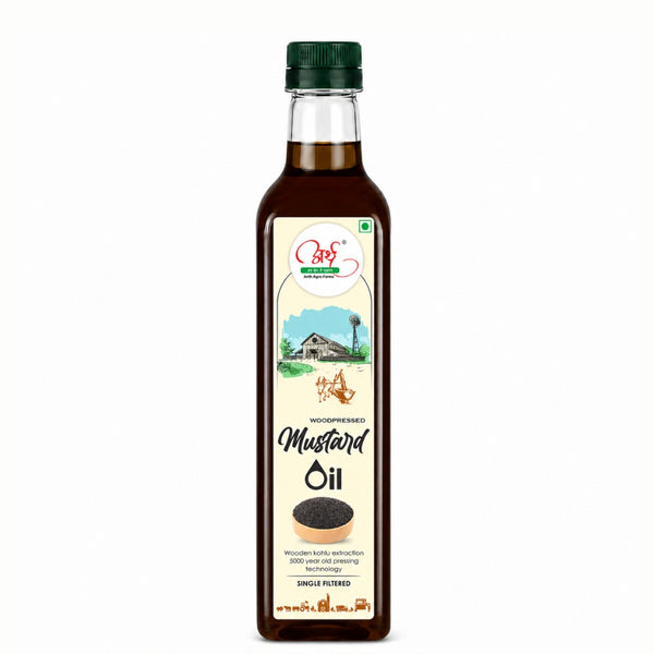 Bottle of mustard oil with a label on a white background