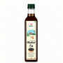 Bottle of mustard oil with a label on a white background