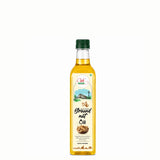 Bottle of groundnut oil with a green cap on a white background
