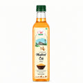 Bottle of mustard oil with a green cap on a white background