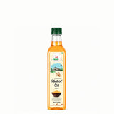 Bottle of mustard oil with a green cap on a white background