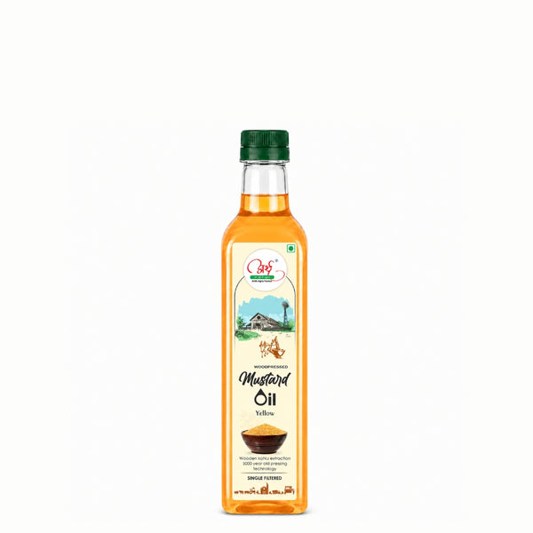 Bottle of mustard oil with a green cap on a white background