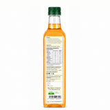 Bottle of olive oil with a green cap on a white background
