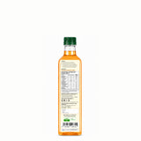 Bottle of olive oil with a green cap on a white background