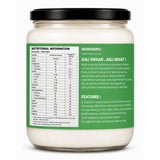 Jar of coconut oil with nutritional information and ingredients label on a white background